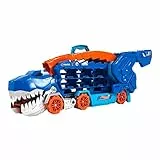 ​Hot Wheels City - Mega Dino Trasportatore, pista da corsa che si trasforma in un T-Rex, playset con luci e suoni, box per riporre 20 macchinine in scala 1:64, giocattolo per bambini, 4+ anni, HNG50
