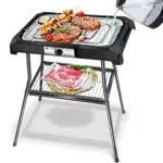 Aigostar Lava Pro - Griglia senza fumo, griglia per barbecue elettrica con piedini e tavolo da esterno. Antiaderente con vassoio rimovibile